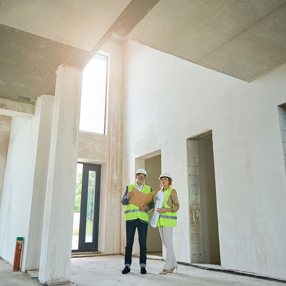 Image shows the interior of a building project that's partly completed. Image depicts new builds in Hitchin