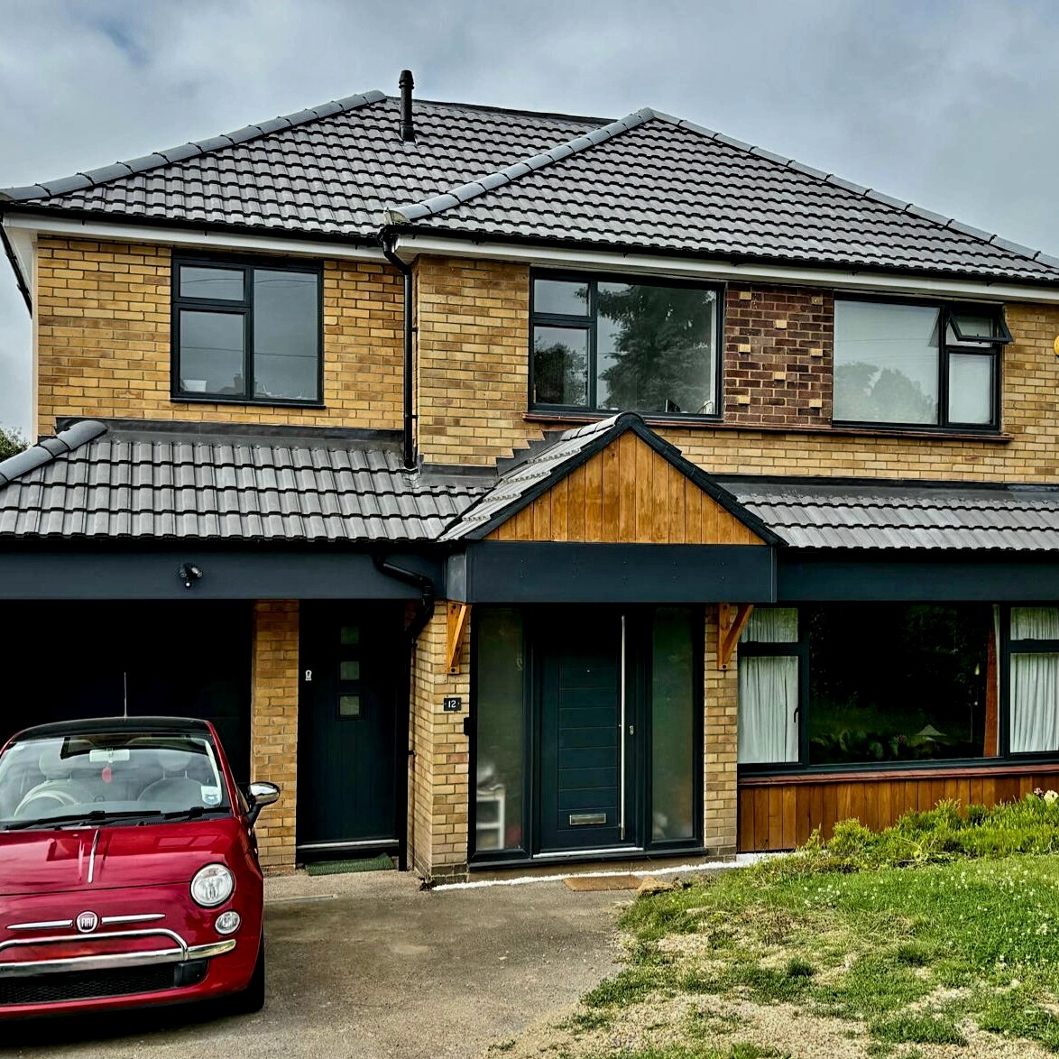 Image shows a house with a newly completed large side extension in Hitchin.