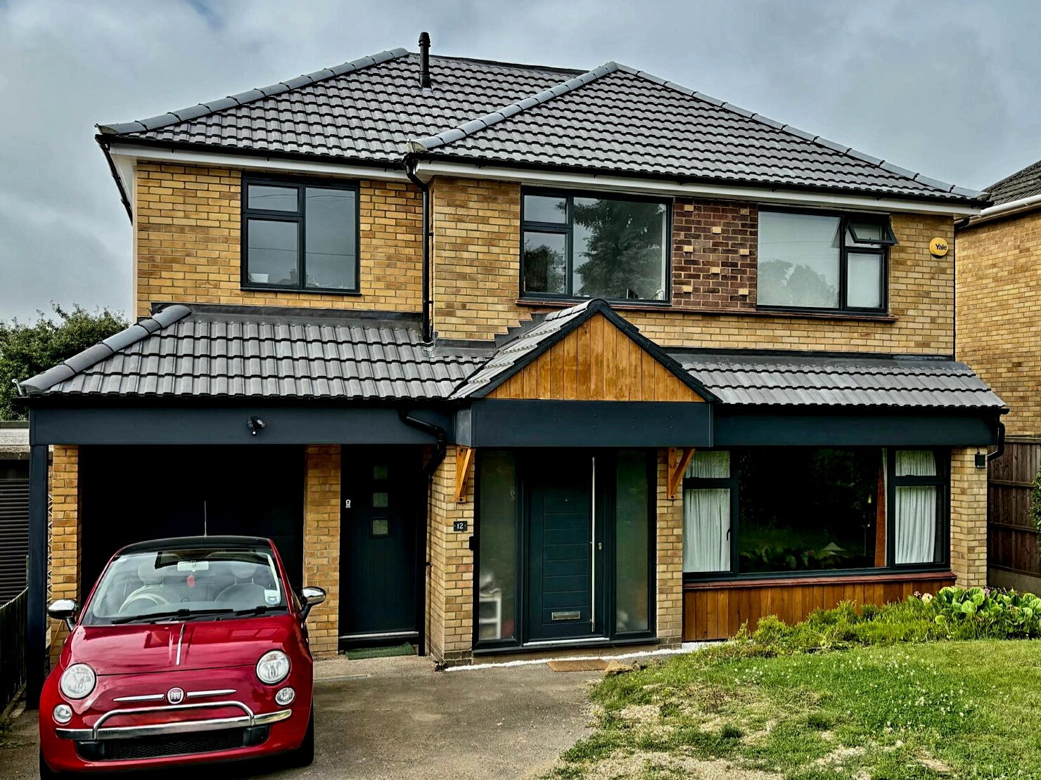 Image shows a house with a newly completed large side extension in Hitchin.