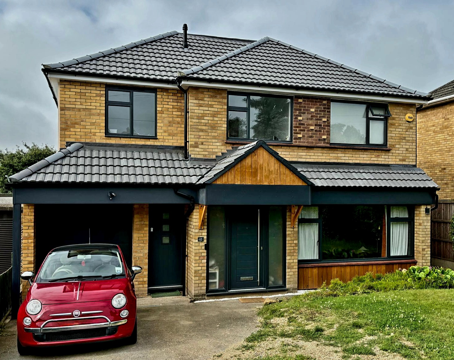 Image shows a house with a newly completed large side extension in Hitchin.