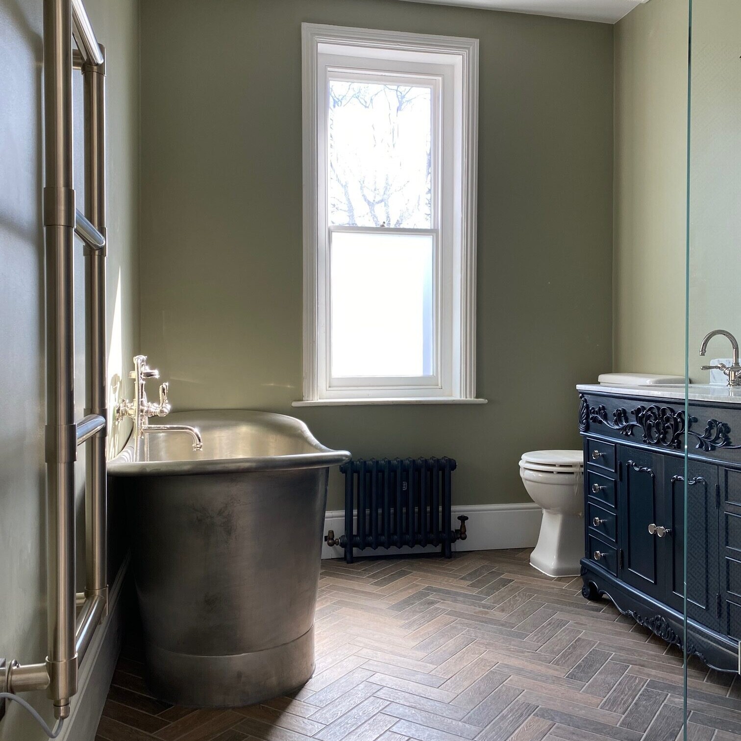 Image shows a luxury bathroom that has been finished as part of a ground floor and loft conversion project