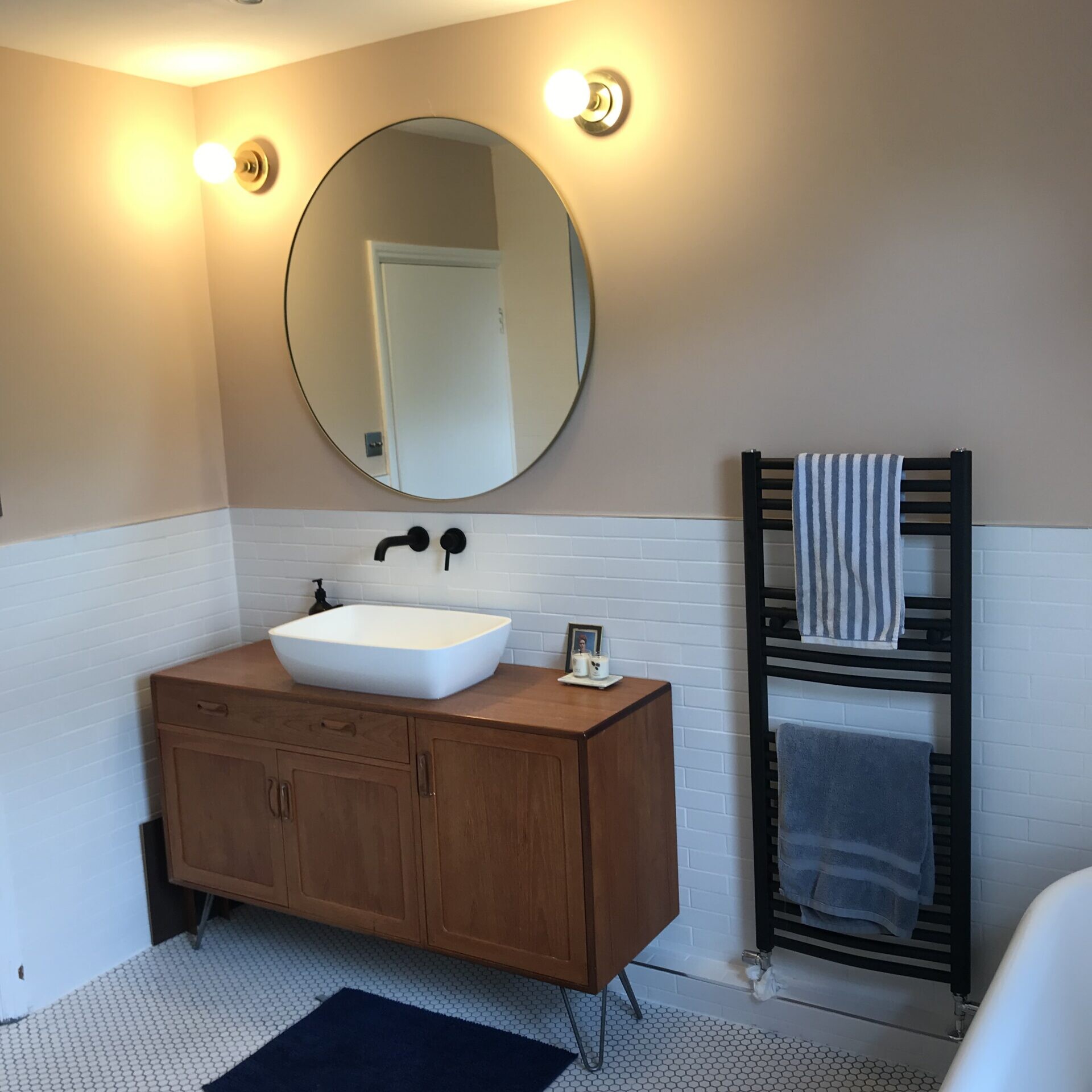 Image shows a sink unit in a newly completed bathroom