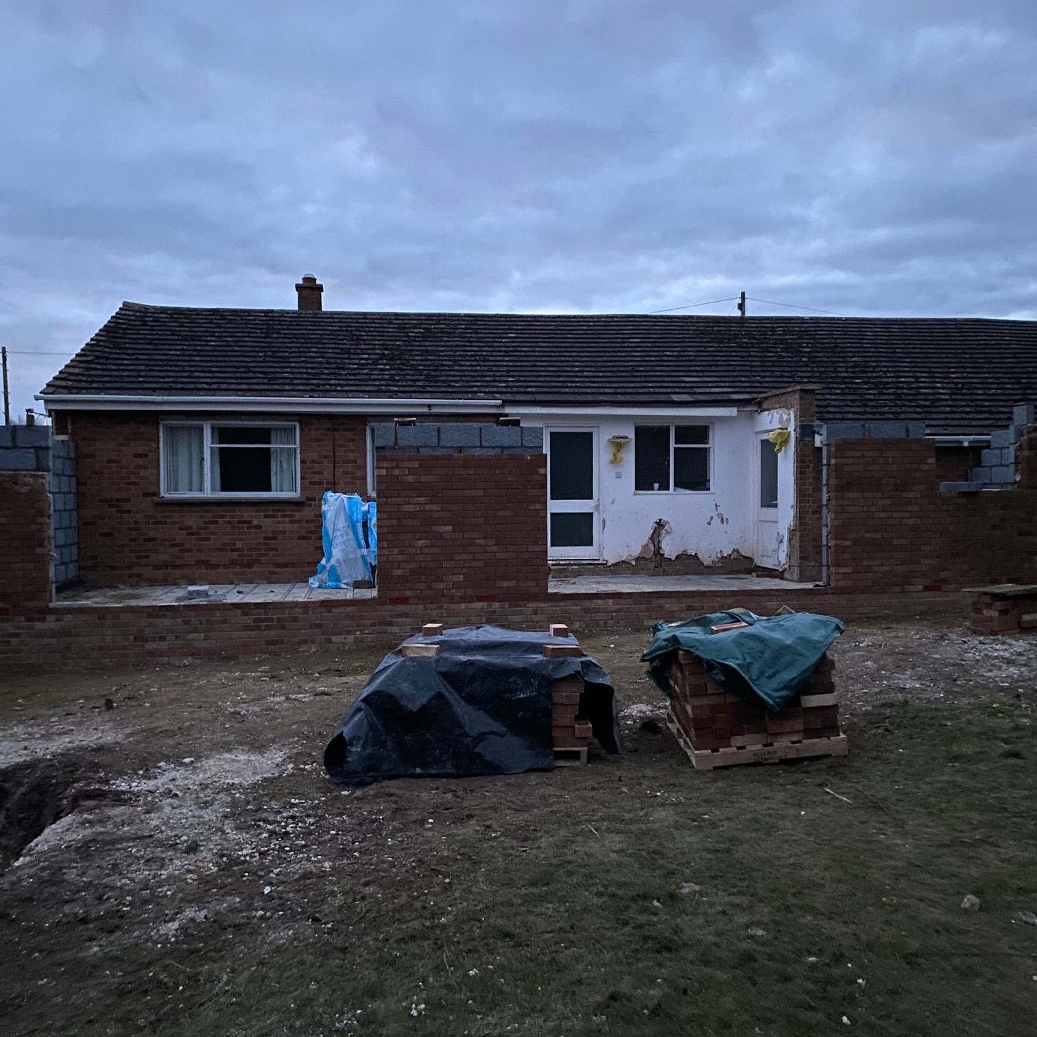 Image shows the brickwork of a bungalow extension partly completed